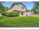 Well-maintained backyard with lush green grass and mature trees, perfect for outdoor activities at 4780 W 102Nd Pl, Westminster, CO 80031