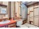 Unfinished bathroom featuring a sink, toilet, exposed ductwork, and a fire extinguisher at 4780 W 102Nd Pl, Westminster, CO 80031