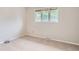 Simple bedroom featuring neutral carpet, window, and electrical outlets providing a quiet space at 4780 W 102Nd Pl, Westminster, CO 80031