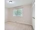 Clean, carpeted bedroom with a window that offers natural light and closet at 4780 W 102Nd Pl, Westminster, CO 80031