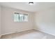 Neutral bedroom with a large window allowing natural light to stream in, carpeted floors and recessed lighting at 4780 W 102Nd Pl, Westminster, CO 80031