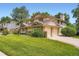 A well-maintained two-story home featuring a two-car garage, lush lawn, and mature trees on a sunny day at 4780 W 102Nd Pl, Westminster, CO 80031