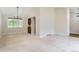 Bright living room with a vaulted ceiling, neutral carpet, stylish chandelier, and natural light from the window at 4780 W 102Nd Pl, Westminster, CO 80031