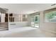 Open living room area with sliding glass doors and access to the backyard and natural light at 4780 W 102Nd Pl, Westminster, CO 80031