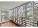 Enclosed balcony with tile floors and lots of natural light coming in from the large windows at 350 S Clinton St # 9C, Denver, CO 80247