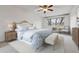 Comfortable bedroom featuring a ceiling fan, large window, and neutral decor at 350 S Clinton St # 9C, Denver, CO 80247