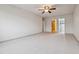 The bedroom features a ceiling fan, neutral carpet, and view into the walk-in closet at 350 S Clinton St # 9C, Denver, CO 80247