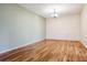 Empty dining room space showcasing hardwood floors, ample natural light, and neutral paint at 350 S Clinton St # 9C, Denver, CO 80247