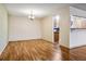 Spacious dining area features hardwood flooring and a modern chandelier at 350 S Clinton St # 9C, Denver, CO 80247