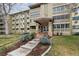 Beautiful exterior view of condo building with well-kept landscaping and welcoming entrance at 350 S Clinton St # 9C, Denver, CO 80247