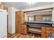 Well-appointed kitchen with breakfast bar, granite countertops, and wooden cabinets at 350 S Clinton St # 9C, Denver, CO 80247