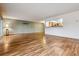 Spacious living room features wood floors and an open view to the kitchen at 350 S Clinton St # 9C, Denver, CO 80247