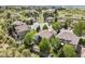 Stunning aerial view of a neighborhood featuring lush greenery and hillside views at 12380 Jasper Pointe Way, Castle Pines, CO 80108