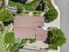 Aerial view highlighting the roof, landscaping, and spacious driveway at 12380 Jasper Pointe Way, Castle Pines, CO 80108