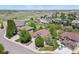 Aerial view of a home in a suburban neighborhood with mature trees and landscaping at 12380 Jasper Pointe Way, Castle Pines, CO 80108