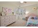 Bright bedroom featuring a pink dresser and pink accent decor at 12380 Jasper Pointe Way, Castle Pines, CO 80108
