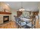 Dining room with a fireplace and a view to the kitchen at 12380 Jasper Pointe Way, Castle Pines, CO 80108