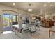 Spacious game room with a ping pong table, access to the deck, fireplace, and bar area at 12380 Jasper Pointe Way, Castle Pines, CO 80108