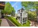 Backyard playground with a slide, picnic table, and well-maintained landscaping at 12380 Jasper Pointe Way, Castle Pines, CO 80108