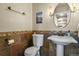 Cozy powder room featuring stylish accents and unique tile at 12380 Jasper Pointe Way, Castle Pines, CO 80108