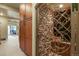 This home has a temperature-controlled wine cellar with custom iron door and storage at 12380 Jasper Pointe Way, Castle Pines, CO 80108