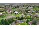 Spacious neighborhood view showcasing lush green landscape, mature trees and homes nestled among them at 1930 Taft Dr, Lakewood, CO 80215