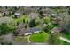 Stunning aerial view of a charming home nestled among lush greenery and mature trees at 1930 Taft Dr, Lakewood, CO 80215