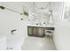 Bright bathroom with a white toilet and a vanity with sink, mirror, and lights at 1930 Taft Dr, Lakewood, CO 80215