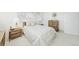 A simple bedroom with two windows and neutral bedding at 1930 Taft Dr, Lakewood, CO 80215