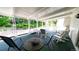 Cozy covered patio with ample seating provides a relaxing outdoor living space with scenic backyard views at 1930 Taft Dr, Lakewood, CO 80215