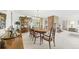 Open concept shows dining area with formal table and chairs, plus view of brick fireplace at 1930 Taft Dr, Lakewood, CO 80215