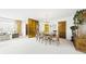 Bright dining room with a stylish chandelier and ample seating for gatherings at 1930 Taft Dr, Lakewood, CO 80215