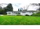 Charming home with a well-manicured lawn and mature trees at 1930 Taft Dr, Lakewood, CO 80215