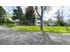 Inviting ranch-style home with mature trees, green lawn, and charming curb appeal at 1930 Taft Dr, Lakewood, CO 80215