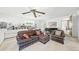 Inviting living room with patterned sofas, built-in bookshelves, and a piano at 1930 Taft Dr, Lakewood, CO 80215