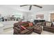 Cozy living room with patterned sofas, built-in bookshelves, and a grand piano at 1930 Taft Dr, Lakewood, CO 80215