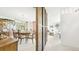 Open-concept living space showcasing a dining area, living room and a glass block wall divider at 1930 Taft Dr, Lakewood, CO 80215