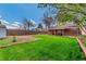 The spacious backyard shows a covered patio overlooking the green lawn at 2274 S Cherry St, Denver, CO 80222