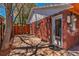 A backyard patio leading to a wood fence and landscaped flowerbeds at 2274 S Cherry St, Denver, CO 80222