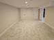Spacious basement features neutral walls and carpet, recessed lighting, and classic white trim and doors at 2274 S Cherry St, Denver, CO 80222