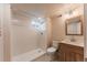 Finished bathroom with glass shower, neutral tile, and modern vanity at 2274 S Cherry St, Denver, CO 80222