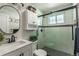 Modern bathroom featuring black fixtures, glass-enclosed shower, and stylish tiling at 2274 S Cherry St, Denver, CO 80222