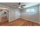 Spacious bedroom features wood floors, a ceiling fan, and a sliding-door closet at 2274 S Cherry St, Denver, CO 80222
