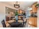 Cozy dining area featuring a round table with seating adjacent to the charming kitchen space at 2274 S Cherry St, Denver, CO 80222
