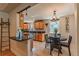 Modern kitchen with natural wood cabinets, granite countertops, and stainless steel appliances at 2274 S Cherry St, Denver, CO 80222