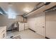 Basement laundry room with washer, dryer, utility sink, and storage at 2274 S Cherry St, Denver, CO 80222