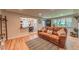 Cozy living room featuring a comfortable sofa, hardwood floors, and plenty of natural light at 2274 S Cherry St, Denver, CO 80222