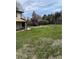 Large backyard with mature trees, wood fence, and a spacious lawn ideal for outdoor activities at 4740 W 108Th Pl, Westminster, CO 80031