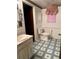 Classic-style bathroom featuring a tile floor, toilet, and vanity with sink and mirror at 4740 W 108Th Pl, Westminster, CO 80031