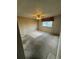 Spacious bedroom featuring a ceiling fan, window with curtains, and neutral-toned walls at 4740 W 108Th Pl, Westminster, CO 80031